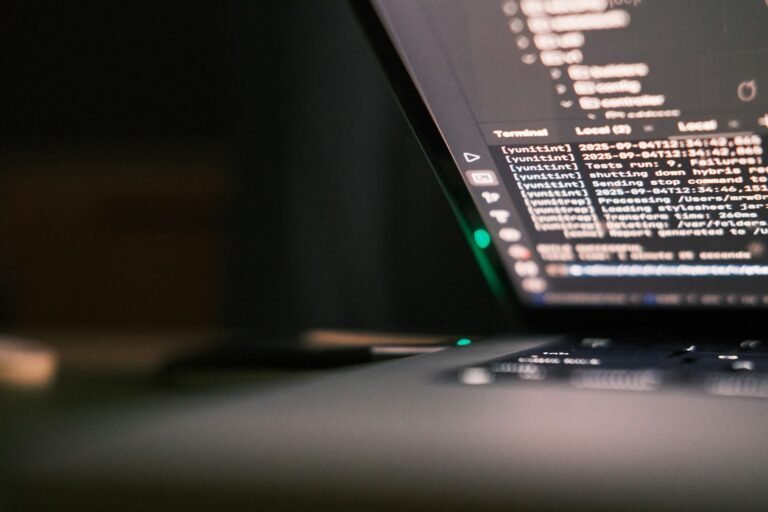 Laptop screen displaying lines of code